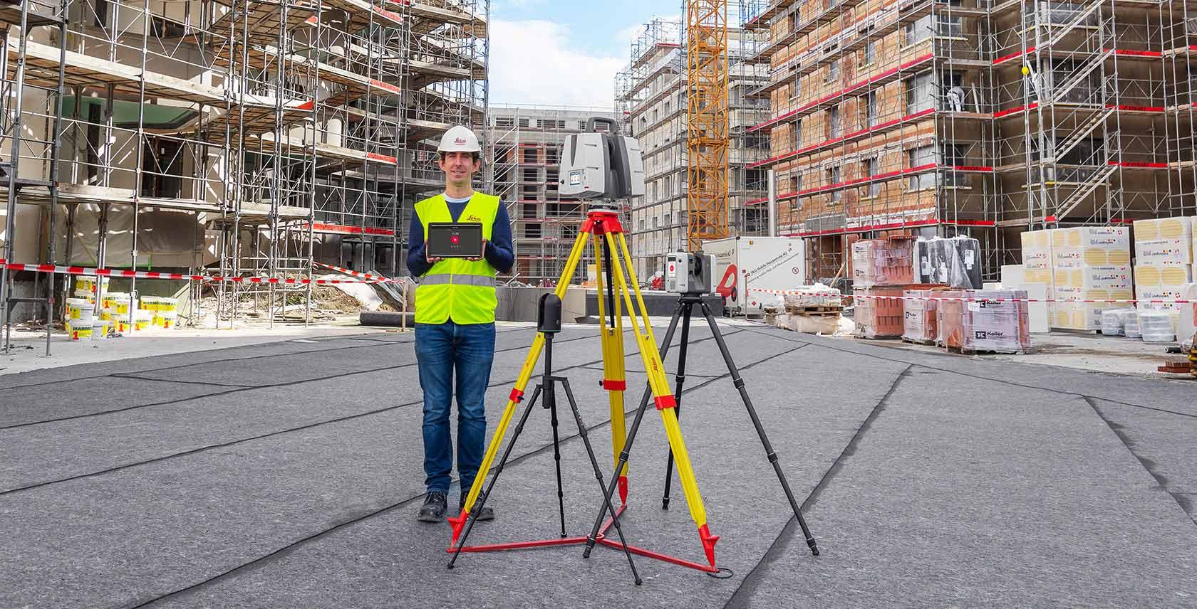 Field engineer next to a terrestrial LiDAR scanner on tripod, ready to capture an as-built building